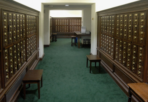 Room of wooden cabinets with hundreds of card file drawers.