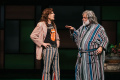 Falstaff (Brian Mani, right) reports back to a disguised Mr. Ford (Eric Hissom) on the affairs of Mrs. Ford in Folger Theatre’s 1970’s-infused The Merry Wives of Windsor. Cameron Whitman Photography.